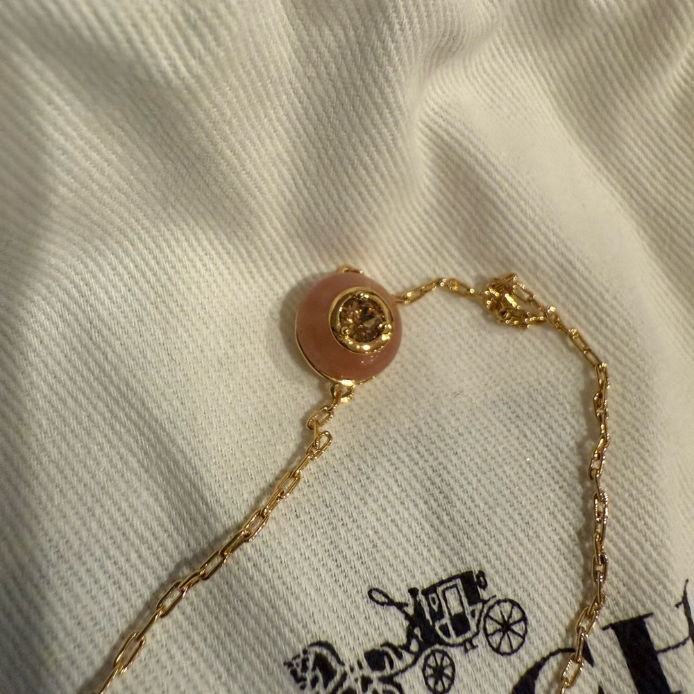 Coach Elegant Gold and Pink Pendant bracelet